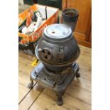 A cast iron pot belly stove by 'Yukon' (as found)