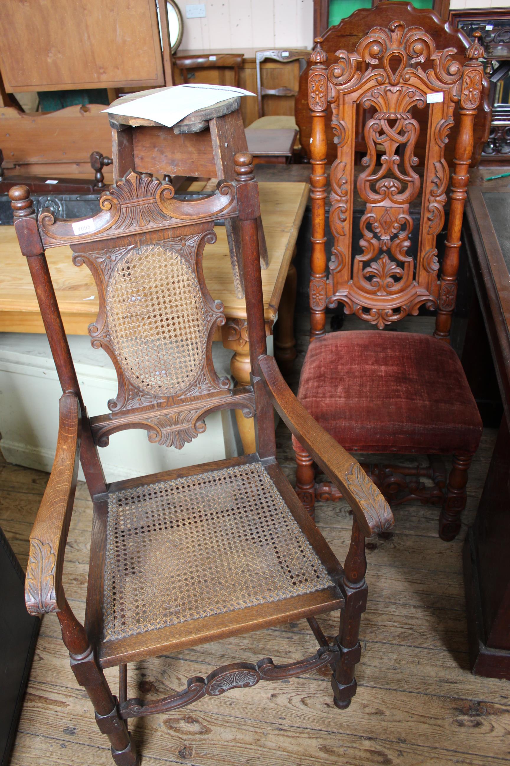 Two early 20th Century carved hardwood chairs including a caned armchair