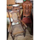 Two early 20th Century carved hardwood chairs including a caned armchair