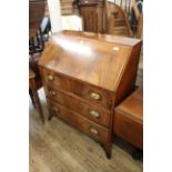 A mid 19th Century mahogany three drawer bureau on splay feet