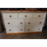 A 20th Century painted pine multi-drawer unit with pine top