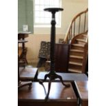 An Victorian carved mahogany torchere