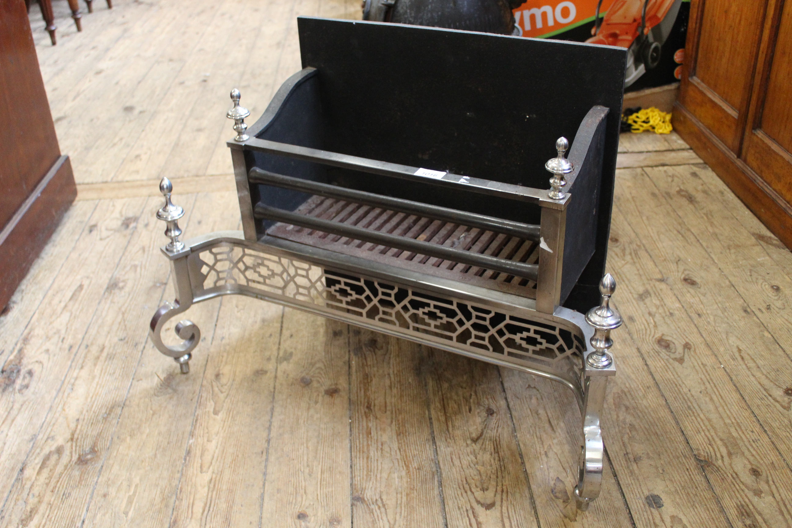 A chrome and cast iron fire place,