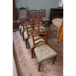 A set of eight Georgian style ladderback chairs