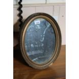 A late 19th Century gilt table mirror with fitted stand