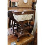 An early Victorian rosewood sewing box platform base with scroll feet