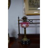 Victorian Brass Column Oil Lamp on Black Ceramic Base with Decorative Pink Glass Bowl