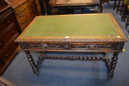 Carved Oak Desk with Inlaid Green Leatherette Top and Lions Head Drawer Pulls