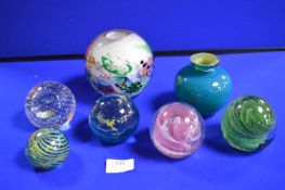 Five Glass Paperweights and Two Glass Vases