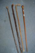 Four Walking Sticks Including One with Inlaid Marquetry