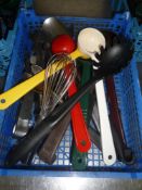 * selection of kitchen utensils - ladles, spoons, slotted spoons, tongs, etc.