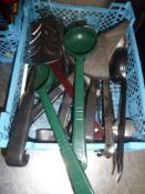 * selection of kitchen utensils - ladles, spoons, slotted spoons, tongs, etc.