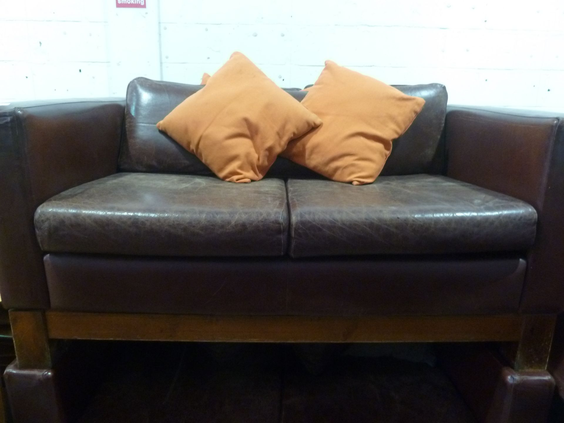 * 2 x distressed red leather sofas with throw cushions 1500w x 800d x 700h