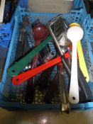 * selection of kitchen utensils - ladles, spoons, slotted spoons, tongs, etc.