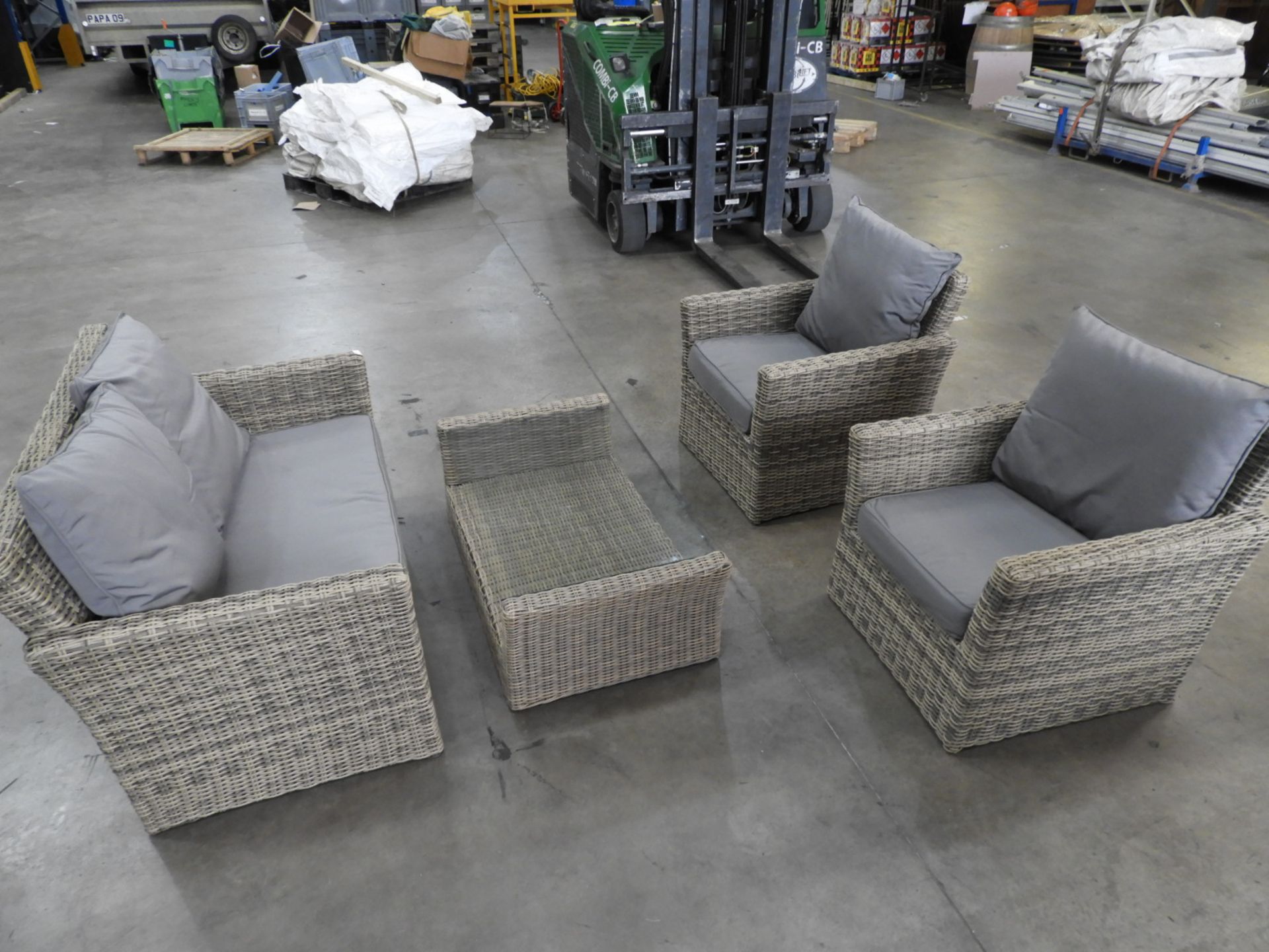 *Rattan Four Piece Patio Set; Two Seat Sofa, Two Easy Chairs and a Table with Plate Glass Top