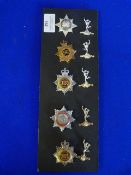 Ten Cap Badges including Signals, Military, and Fire Brigade