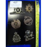 Six Small Army Cap Badges