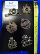Six Small Army Cap Badges