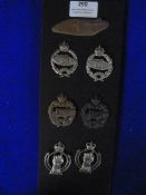 Seven British Cavalry Cap Badges