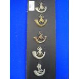 Five Light Infantry Cap Badges