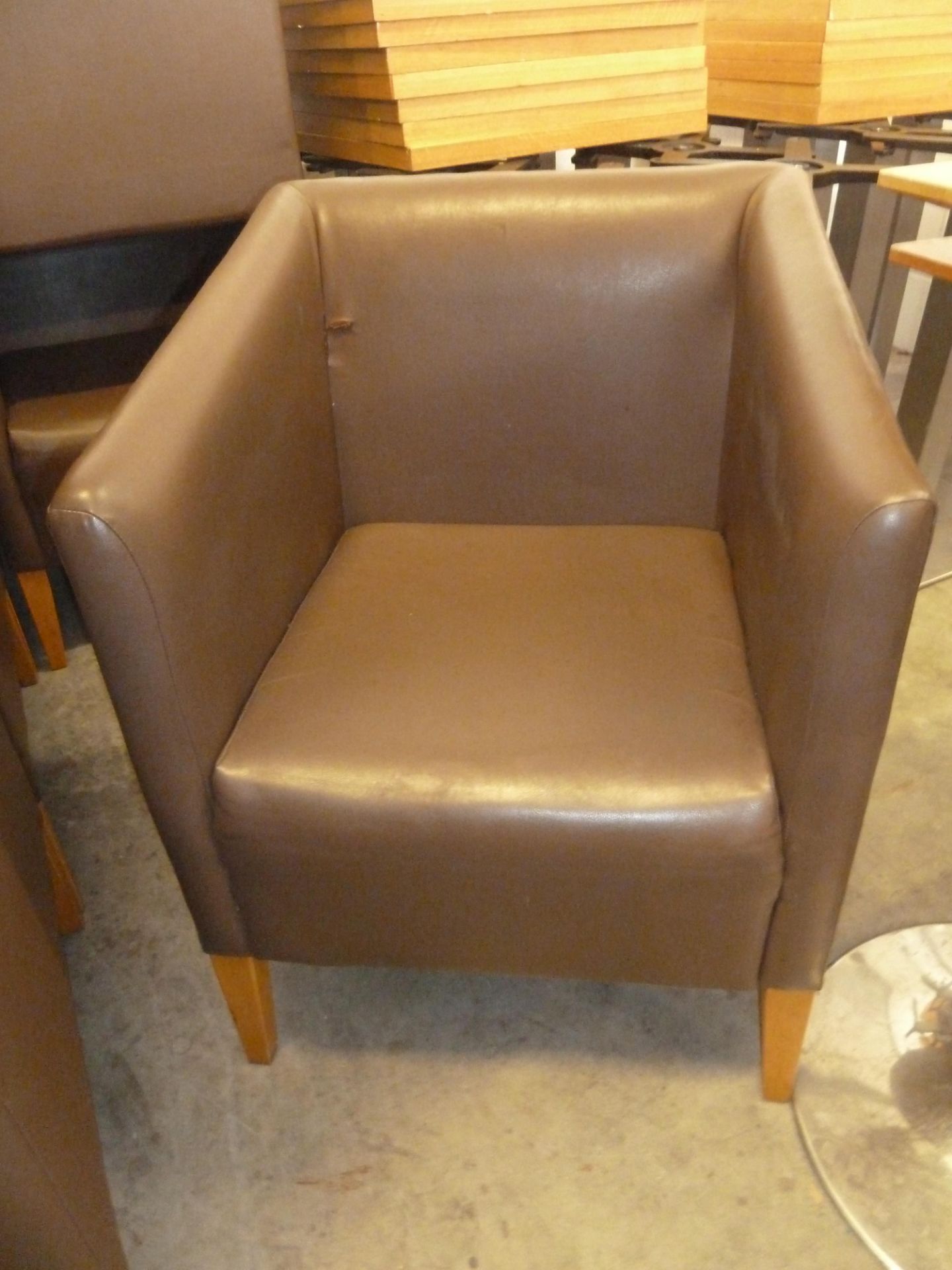 * 2 x brown leather tub chairs with wooden feet. 590w x 600d x 800h