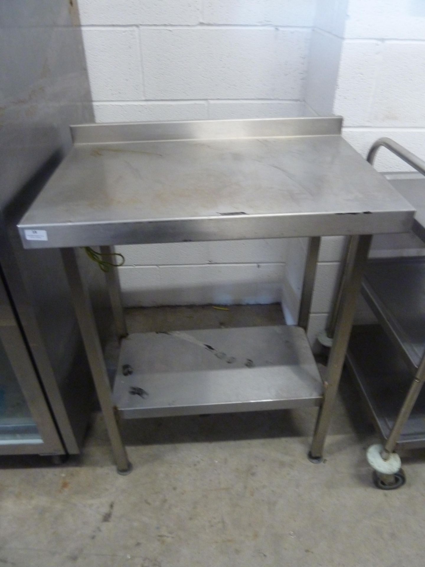 * S/S prep bench with upstand and undershelf. 750w x 500d x 950h