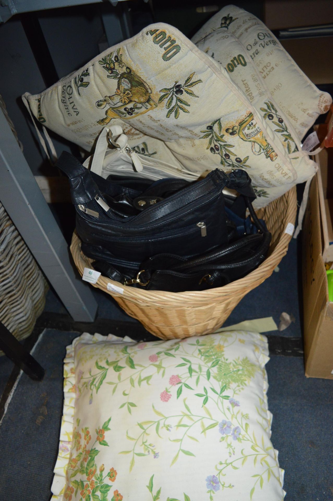 Basket of Handbags and Cushions