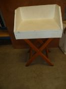 * small table with white top and wooden legs with back