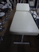 * cream leather massage/treatment table, with adjustable back rest