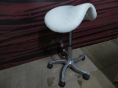 * beauticians stool on castors, with cream seat