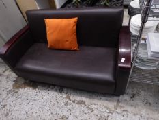 * brown leather sofa with wooden arms. 1450w x 700d x 800h