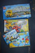 Four Lego Box Sets; Two City, One Racer and One Cr