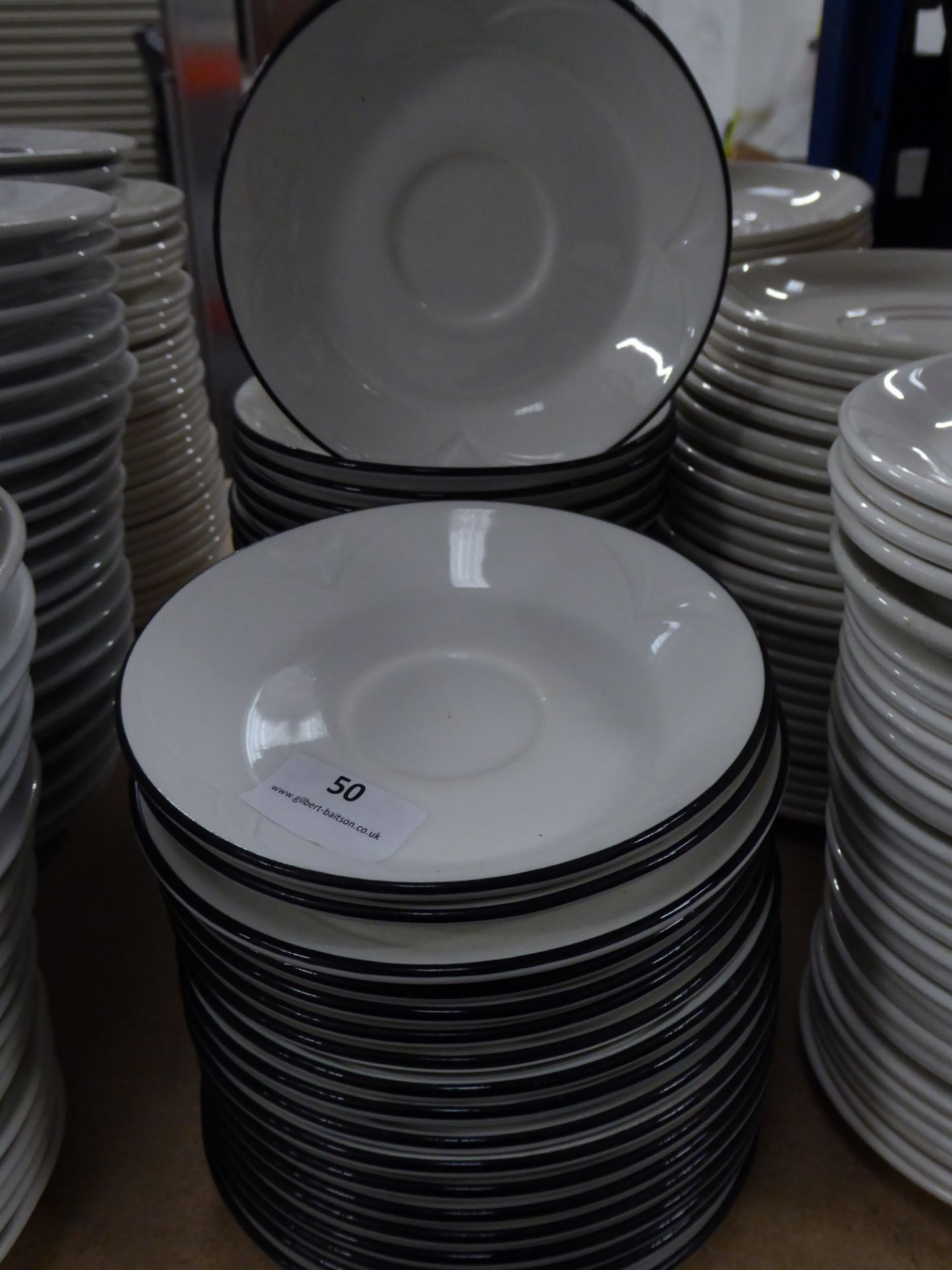 *approx 40 x white saucers with blue rim