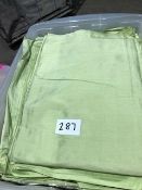 * 9 x pea green silk table cloths 128in x 128in in storage box Located at Grantham, NG32 2AG