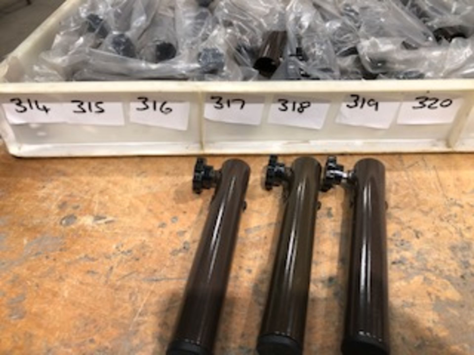 * 10 sets of brand new trestle table extension legs ( 40 pieces) in storage box Located at Grantham,