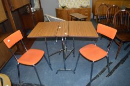 Formica Topped Drop Leaf Table with Chrome Frame and Matching Orange Vinyl Seated Chairs