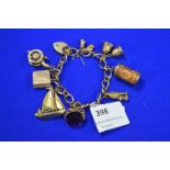 9k Gold Charm Bracelet with Assorted Charms ~36g gross