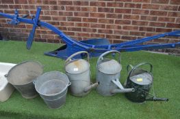 Three Galvanised Watering Cans and Two Buckets