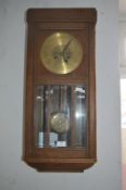 Oak Cased Pendulum Wall Clock circa 1920