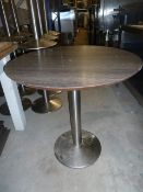 * 4 x round dark wooden tables with S/S pedestal bases. 770 diameter x 760h