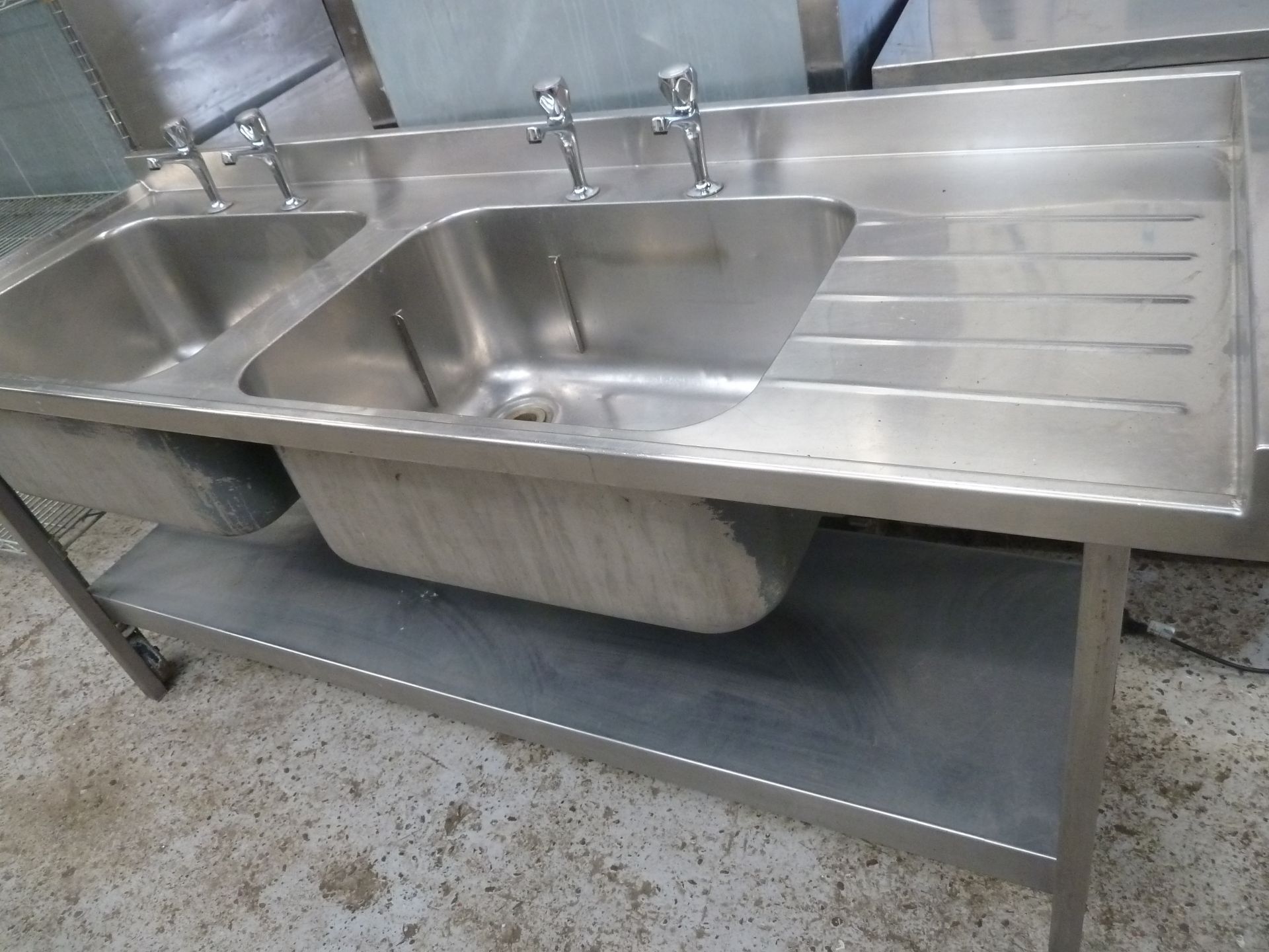 * S/S double bowl sink with small right hand draining board - complete with taps and undershelf. - Image 2 of 5