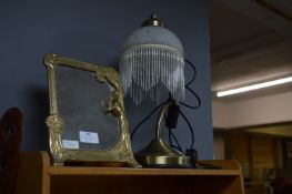 Brass Decorative Mirror and a Table Lamp