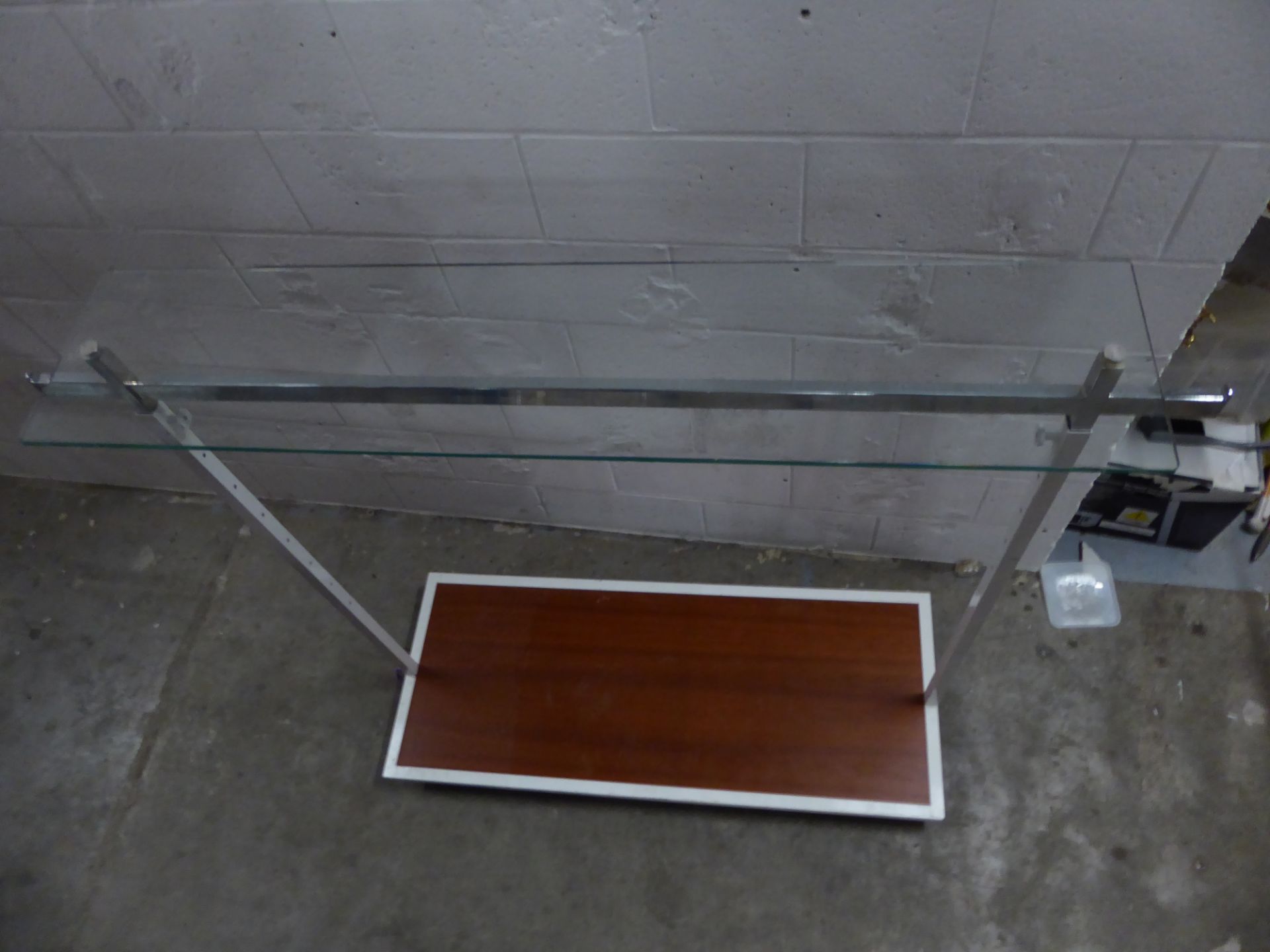 * metal rail with wood effect bottom shelf and glass over shelf on castors. Adjustable height. 1600w - Image 3 of 3