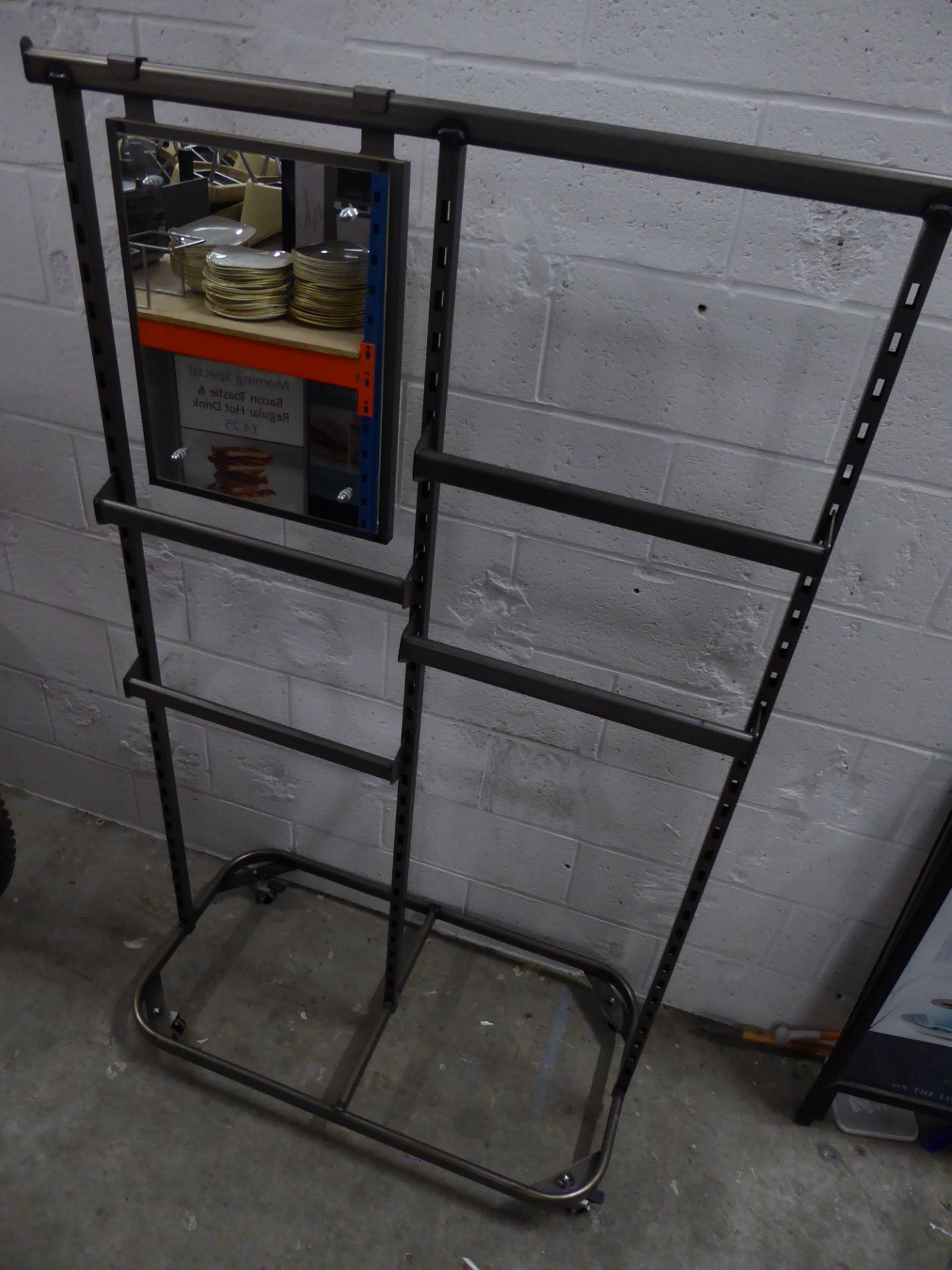 * grey metal clothes rail on castors with 4 adjustable half width rails and hook on mirror. 1130w