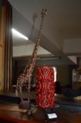 Ethnic Carved Wood Giraffe and a Decorative Candle