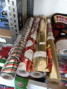 *Four Rolls of Christmas Wrapping Paper