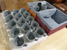 *Two Baskets and a Quantity of Blue Grey Mugs
