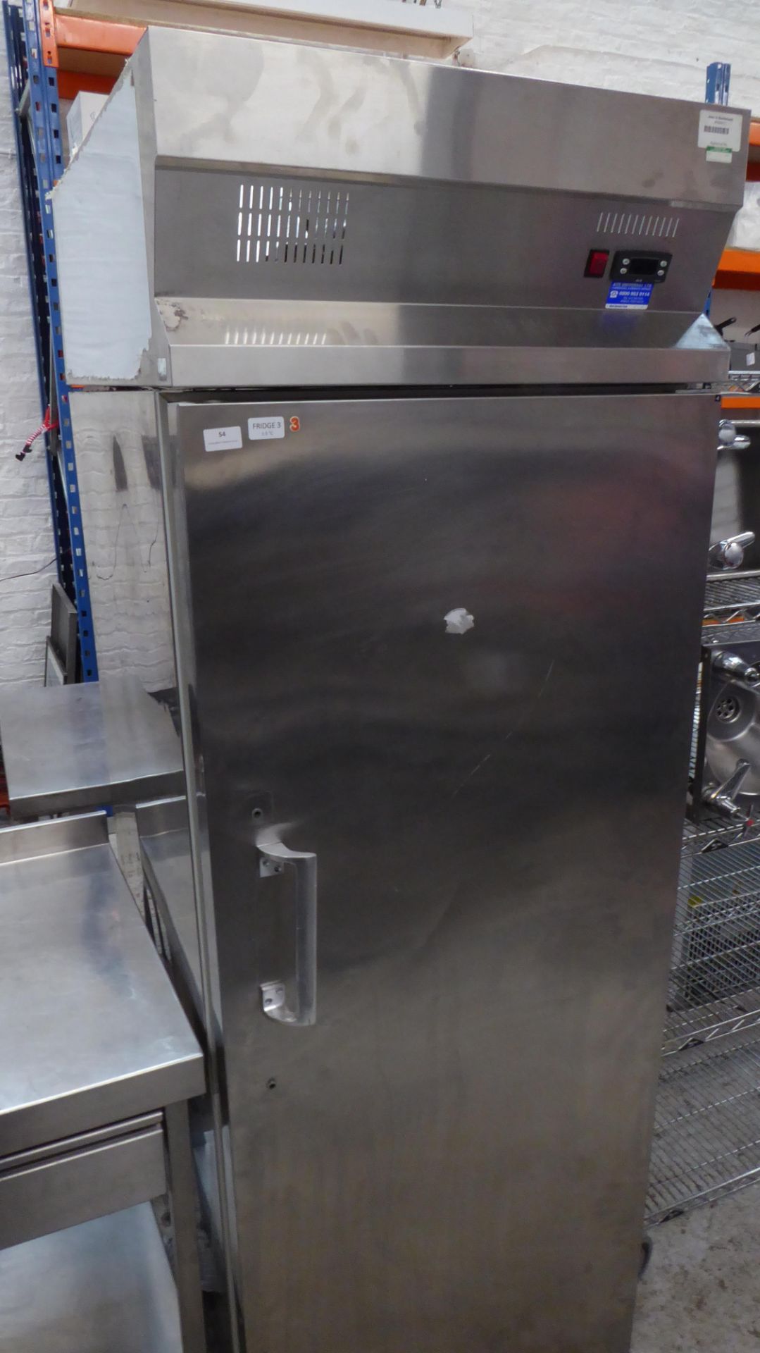 * S/S upright fridge on castors. 700w x 850d x 2050