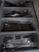 * grey tray with selection of cutlery