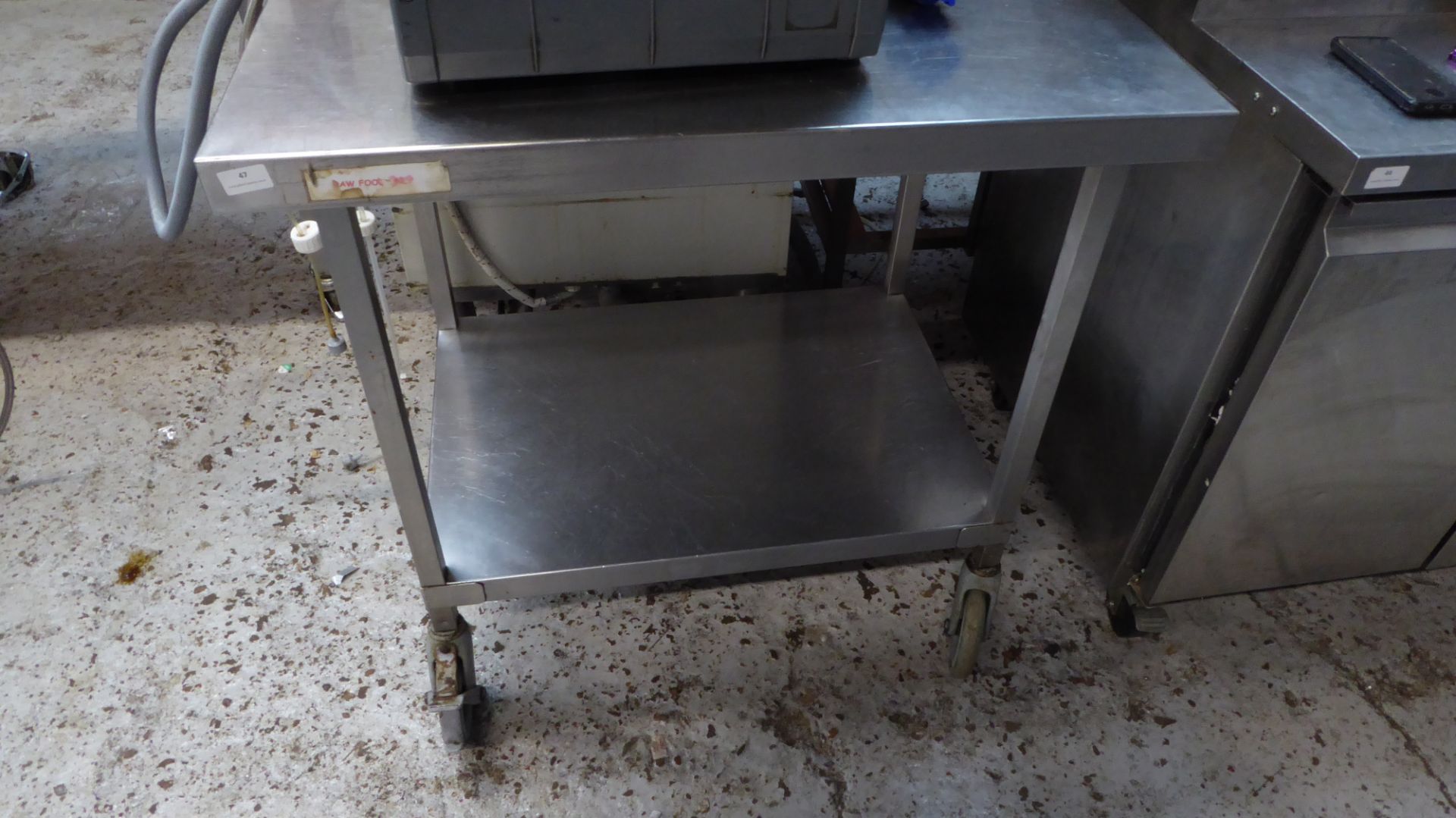 * S/S prep bench on castors with under shelf 900w x 600d x 870h